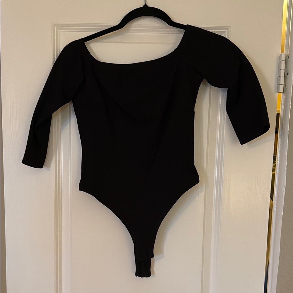 Black off the shoulder, mid arm One Piece Bodysuit